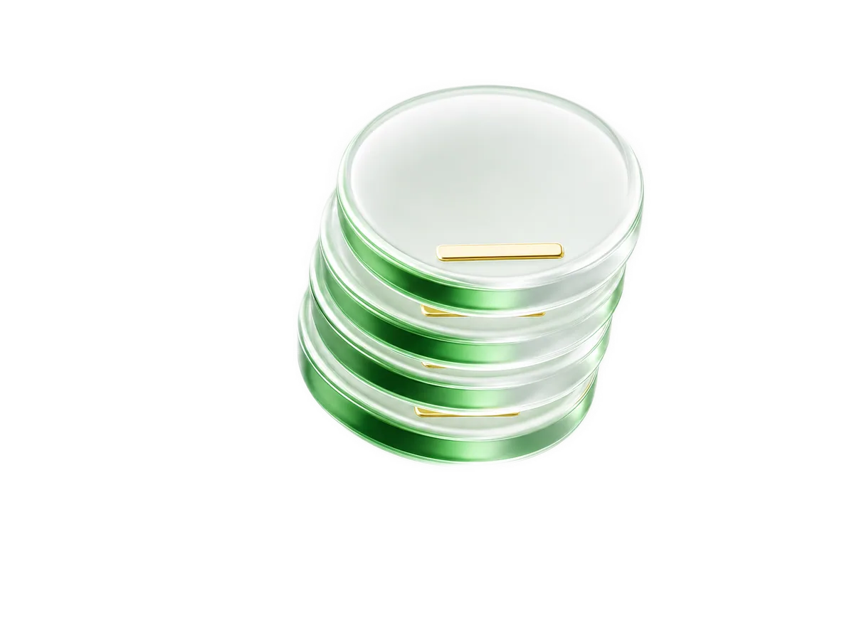 A short stack of rounded coins rendered in green translucent glass with gold accents