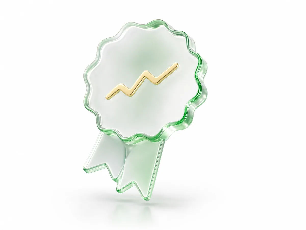 A rounded award seal with a ribbon rendered in green translucent glass with gold accents